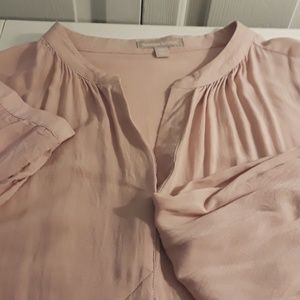 Long sleeve embroidered blush colored blouse.